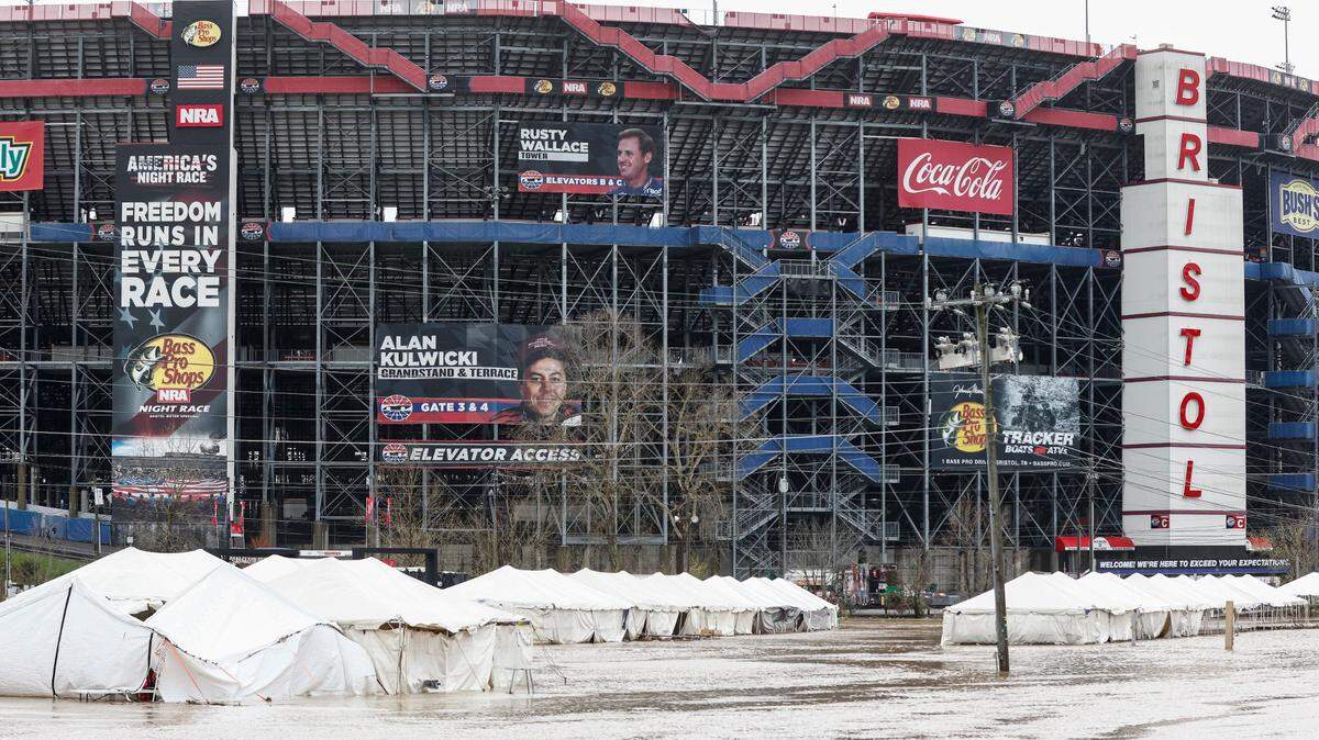 Damaged vendor tents sit in a flooded area near Bristol Motor Speedway as races for both the Truck Series and NASCAR Cup Series auto race was postponed due to inclement weather, Sunday, March 28, 2021, in Bristol, Tenn. (AP Photo/Wade Payne)
