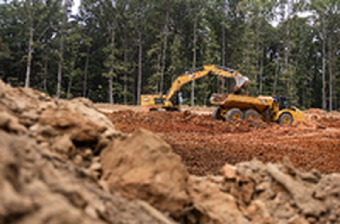 A construction crew works on the East West Connector in Mooresville, N.C., on Friday, September 13, 2024. Two years from completion, the connector has already attracted major housing subdivisions and a planned mega mixed-used community.