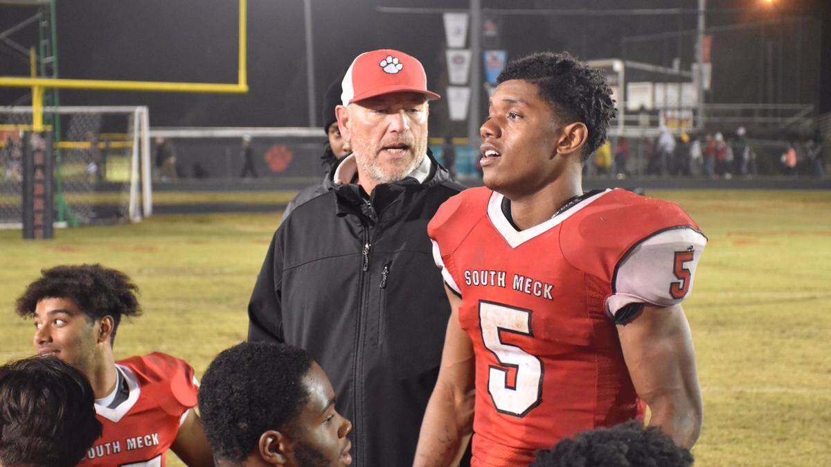 South Mecklenburg’s Jabari Dalton, seen with head coach Rocky White, has rushed for more than 1,000 yards this season