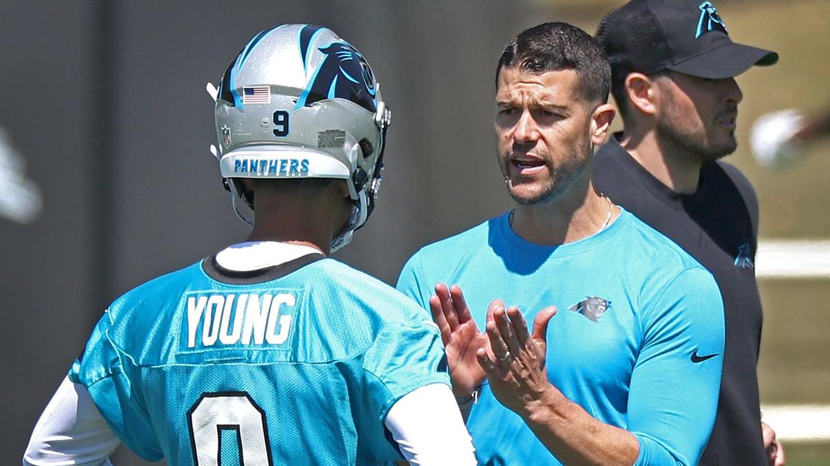Carolina Panthers head coach Dave Canales, right, speaks with quarterback Bryce Young, left, during the team’s voluntary minicamp practice on Tuesday, April 23, 2024.