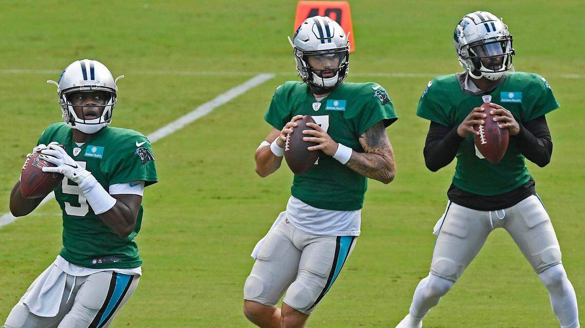 Carolina Panthers quarterback Teddy Bridgewater (5), quarterback Will Grier (7), and quarterback P.J. Walker (6) drop back to pass during practice at Bank of America Stadium during training camp on Saturday, August 22, 2020.