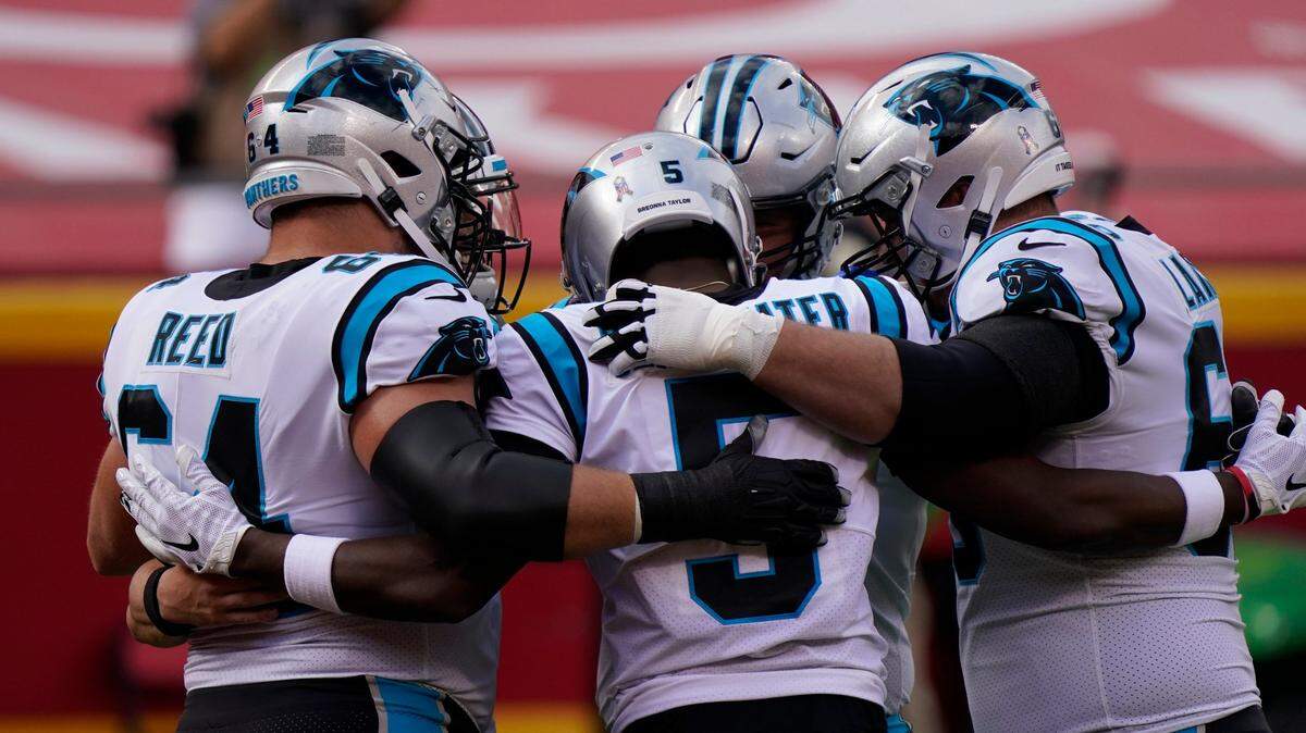 Carolina Panthers quarterback Teddy Bridgewater (5) and teammates huddle as they warm up before an NFL football game against the Kansas City Chiefs in Kansas City, Mo., Sunday, Nov. 8, 2020. (AP Photo/Jeff Roberson)