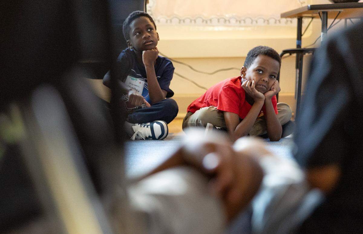Students get started on their first lesson of the day during the first day of school at Elizabeth Traditional School in Charlotte, N.C., on Monday, August 25, 2025.