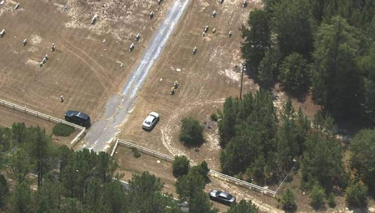 Authorities searching an area where a body was found on Thursday on Cemetery Road in Montgomery County. 