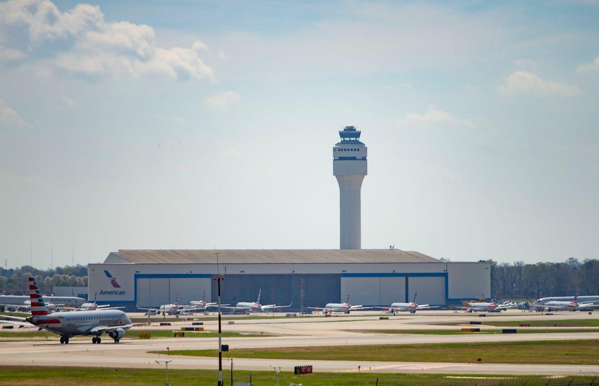 Planes sit idle at the American Airlines hanger at the Charlotte Douglas International Airport in on Friday, March 20, 2020.