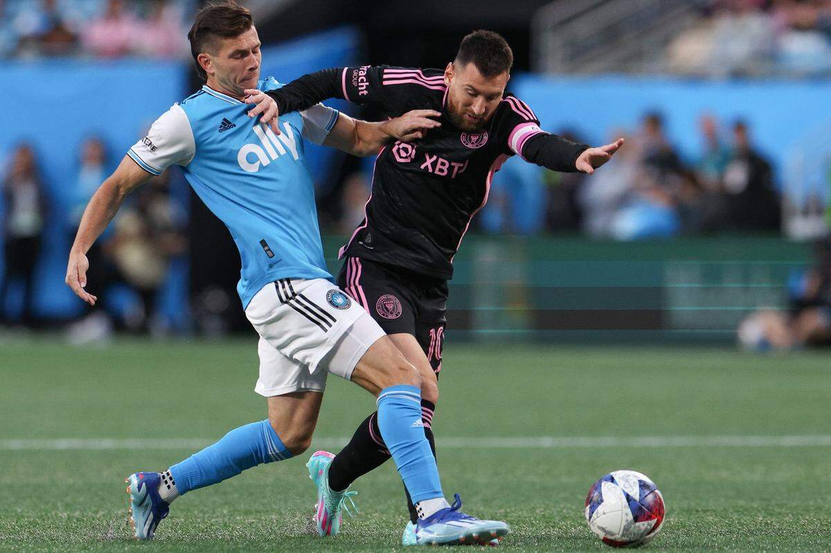 Charlotte FC midfielder Brandt Bronico, left, shoves Inter Miami midfielder Lionel Messi during the match at Bank of America Stadium on Saturday, October 21, 2023 in Charlotte, NC.