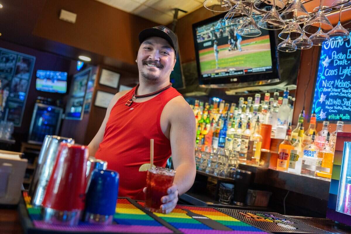 Bartender Michael Nguyen poses for a portrait at Sidelines Sports Bar & Billiards in Charlotte on June 17.