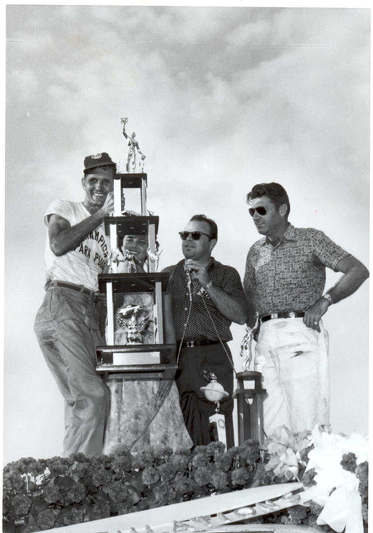 Joe Lee Johnson (left), winner of the inaugural World 600 at Charlotte Motor Speedway in 1960. Also pictured are Bruton Smith (center) and Charlotte Motor Speedway co-owner Curtis Turner (right).