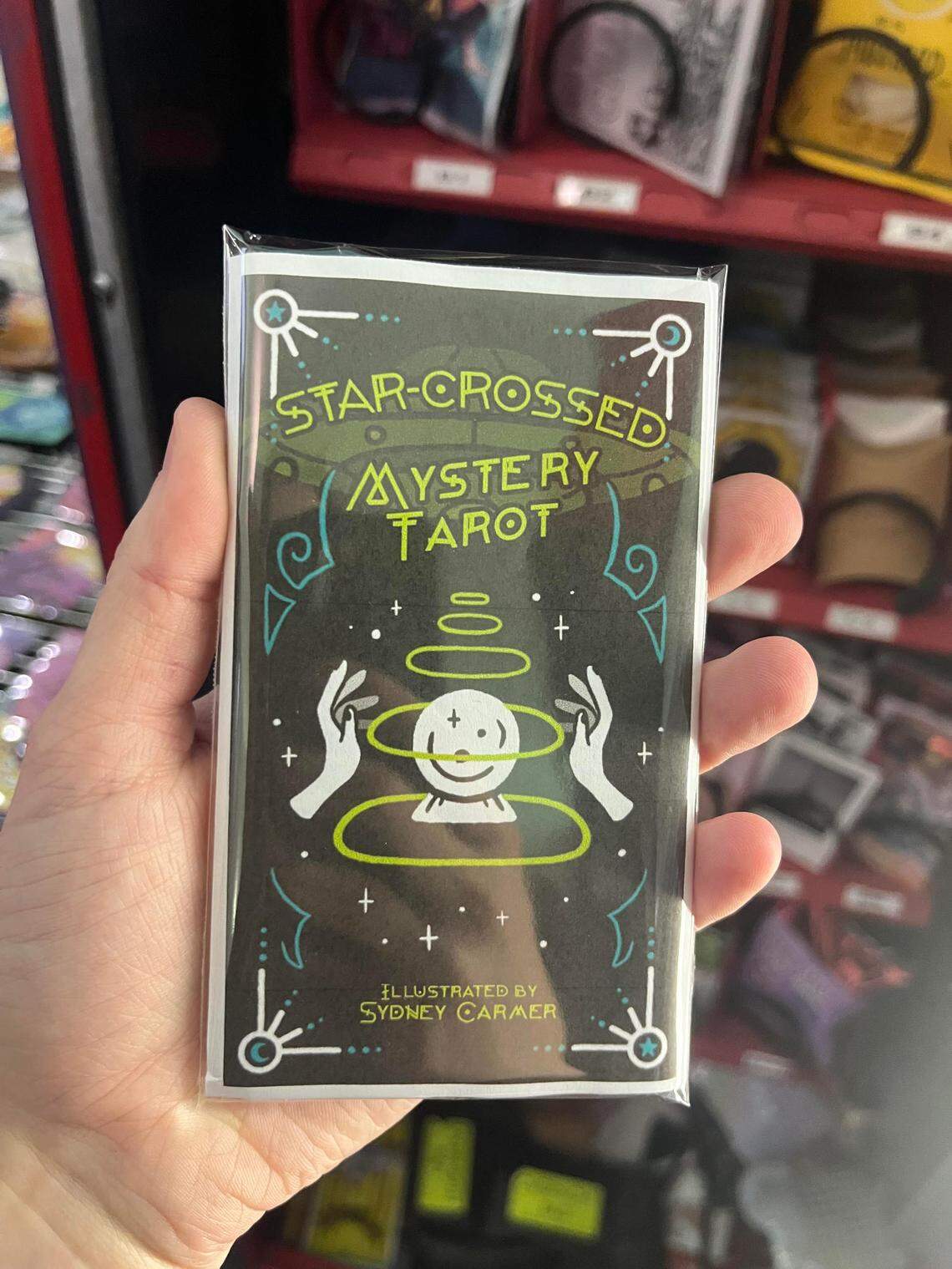 Tarot card art can also be found in some of the Loot Drop Art Club vending machines around the region.