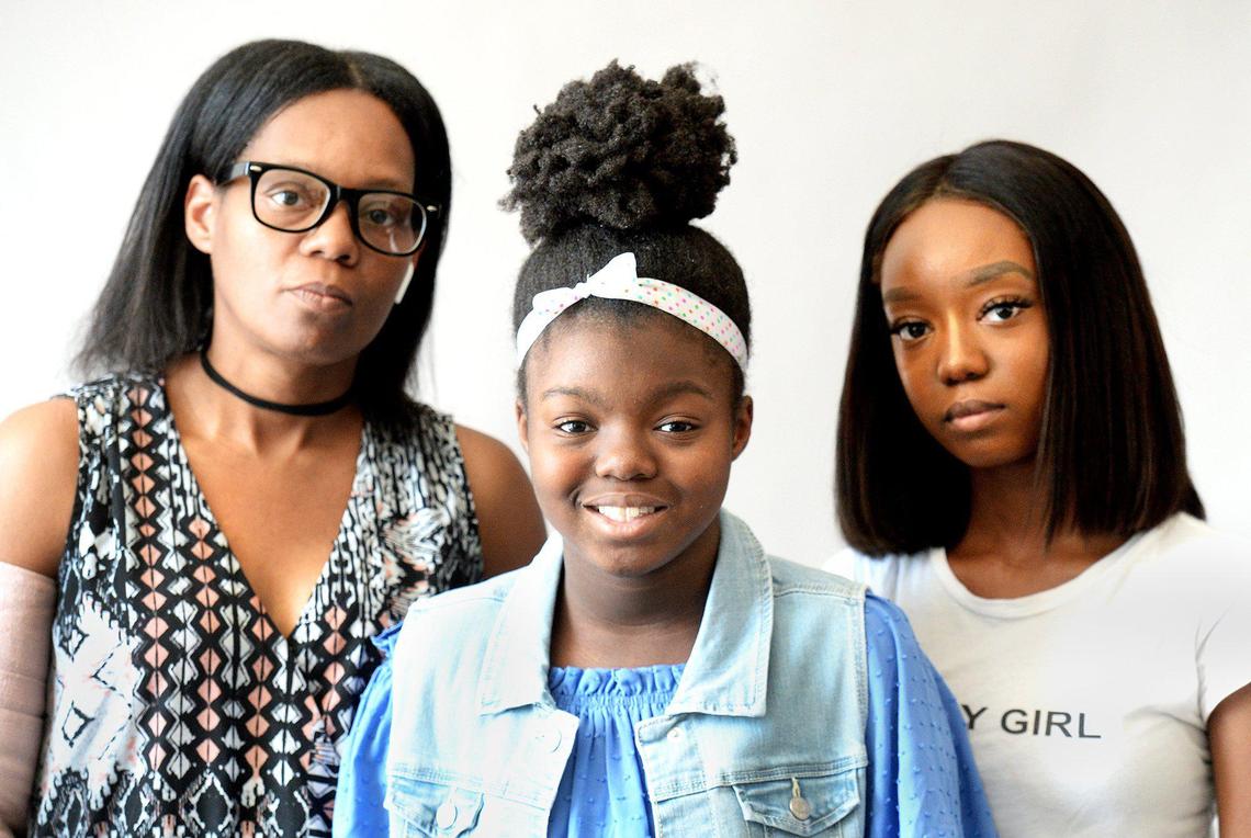 Winifred Frierson, 39, with her daughters Mackenzie Dykes, 11 and Jasmine Trapier, 18. After a series of injuries she sustained at Blythe Elementary school, Mackenzie Dykes’ mother and medical providers say the school contributed to her declining health. Her mother, Winifred Frierson, says CMS has failed to make accommodations for her daughter’s disability and refused to provide adequate homebound education.