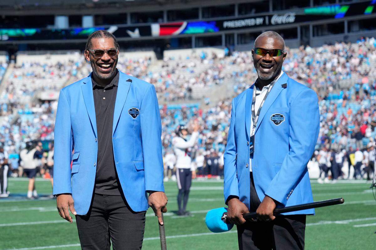 Carolina Panthers greats Julius Peppers and Muhsin Muhammad.