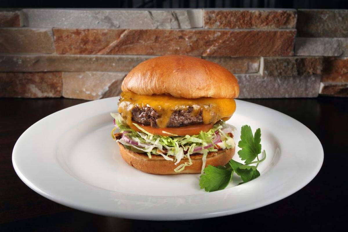 The Angus Cheddar Burger comes with cheddar, lettuce, tomato, red onions, ketchup, pickles and mayo.