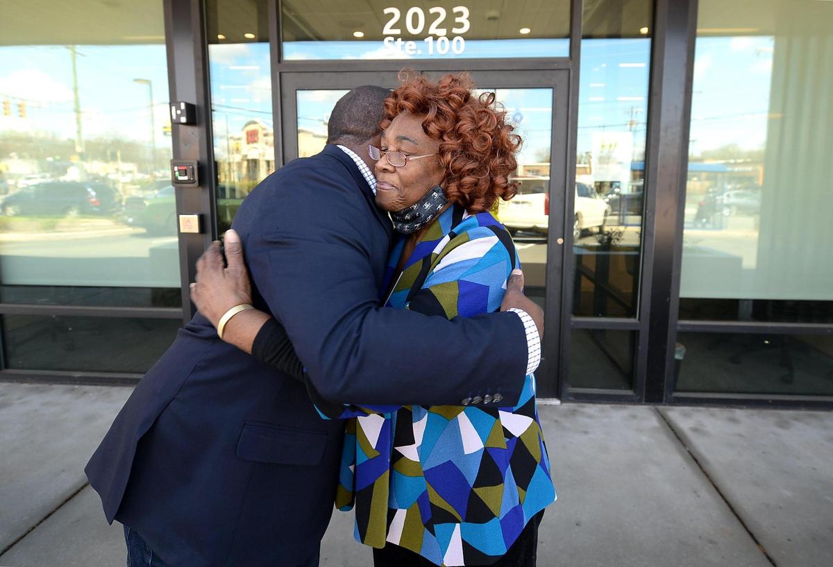 Christopher Dennis, left and Elloree Erwin, right, embrace outside the Chase bank branch at 2023 Beatties Ford Road. Erwin, a longtime resident on Charlotte’s west side, recalls going to McDonald’s Cafeteria when it was located further up Beatties Ford Road in the 1980s. It became a staple in the Black community as a social and political gathering place.