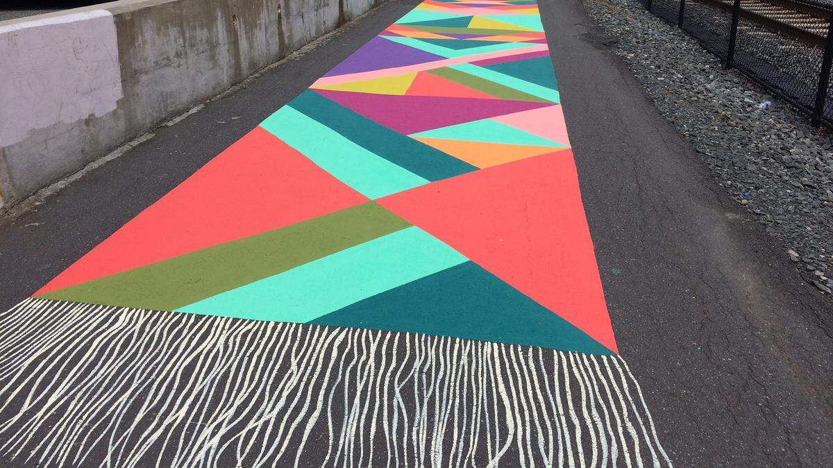 The Charlotte Rail Trail is filled with artistic expression, including Magic Carpet Murals. Photo by Katie Toussaint.