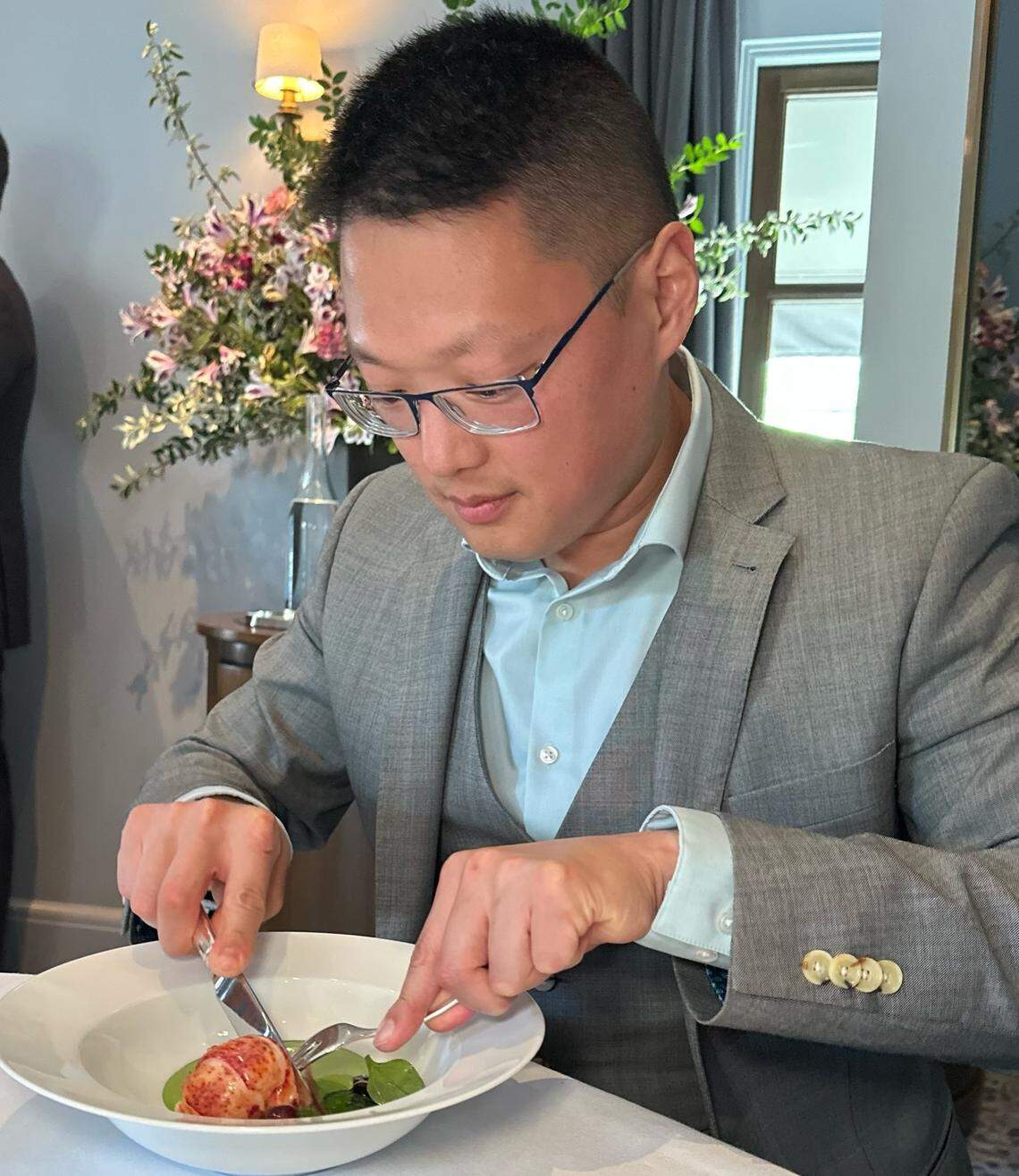 Michael Chilly Winters, whose leisure time focuses on traveling to Michelin Star restaurants and other fine dining spots, is shown here at the iconic Thomas Keller restaurant, The French Laundry. On the plate at the restaurant with three Michelin Stars is sweet butter-poached Nova Scotia Lobster, wilted Arrowleaf spinach, cured garden turnips, Brooks cherries and spinach-brown butter mousseline.