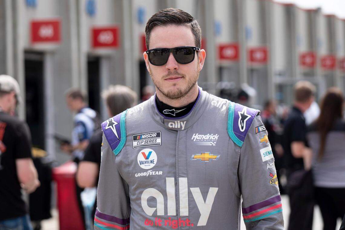 Alex Bowman walks from his garage before qualifying in seventh position for the NASCAR Cup Series auto race at Charlotte Motor Speedway on Saturday, May 29, 2021 in Charlotte, N.C. (AP Photo/Ben Gray)