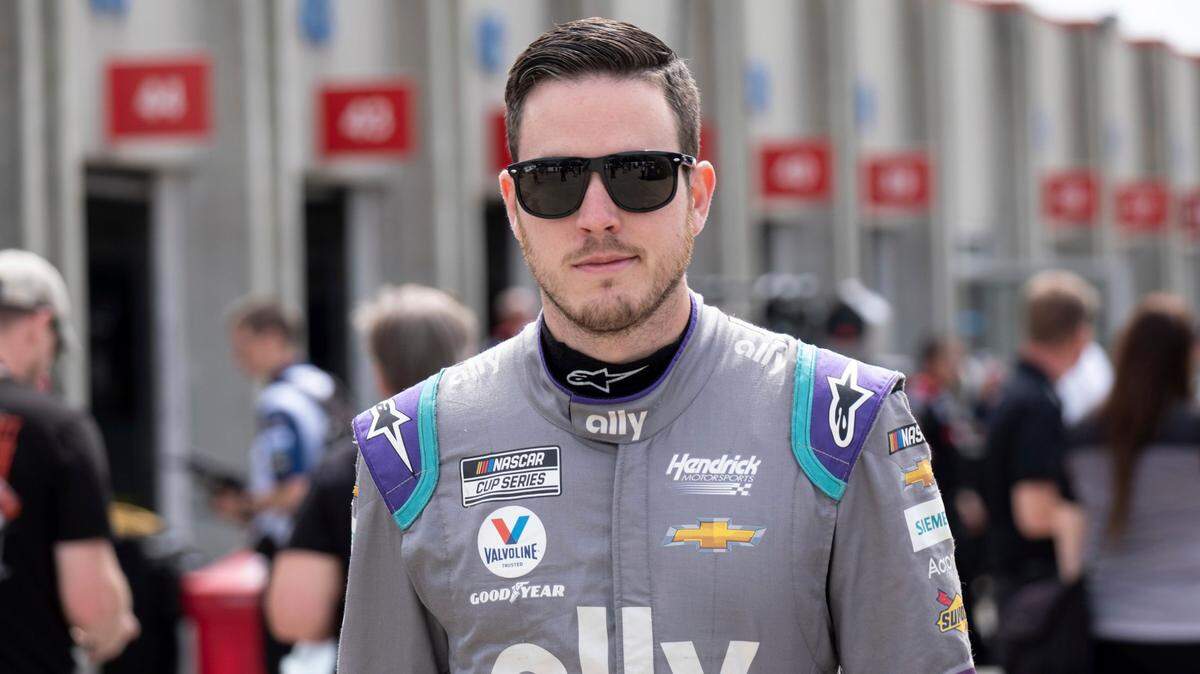 Alex Bowman walks from his garage before qualifying in seventh position for the NASCAR Cup Series auto race at Charlotte Motor Speedway on Saturday, May 29, 2021 in Charlotte, N.C. (AP Photo/Ben Gray)