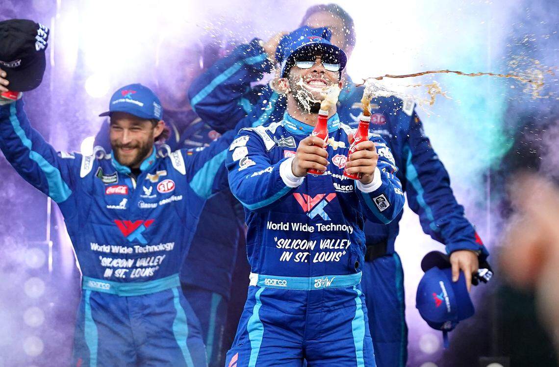 NASCAR driver Bubba Wallace knocks two Coca-Cola bottles together aka. Stone Cold Steve Austin style after qualifying for the All-Star Race on Saturday.