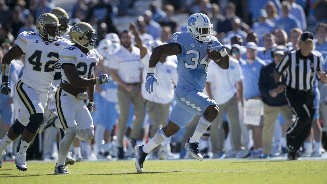 Former North Carolina and Charlotte Catholic star Elijah Hood (34) was claimed off waivers on Tuesday by the Carolina Panthers after being waived by the Oakland Raiders on Monday.