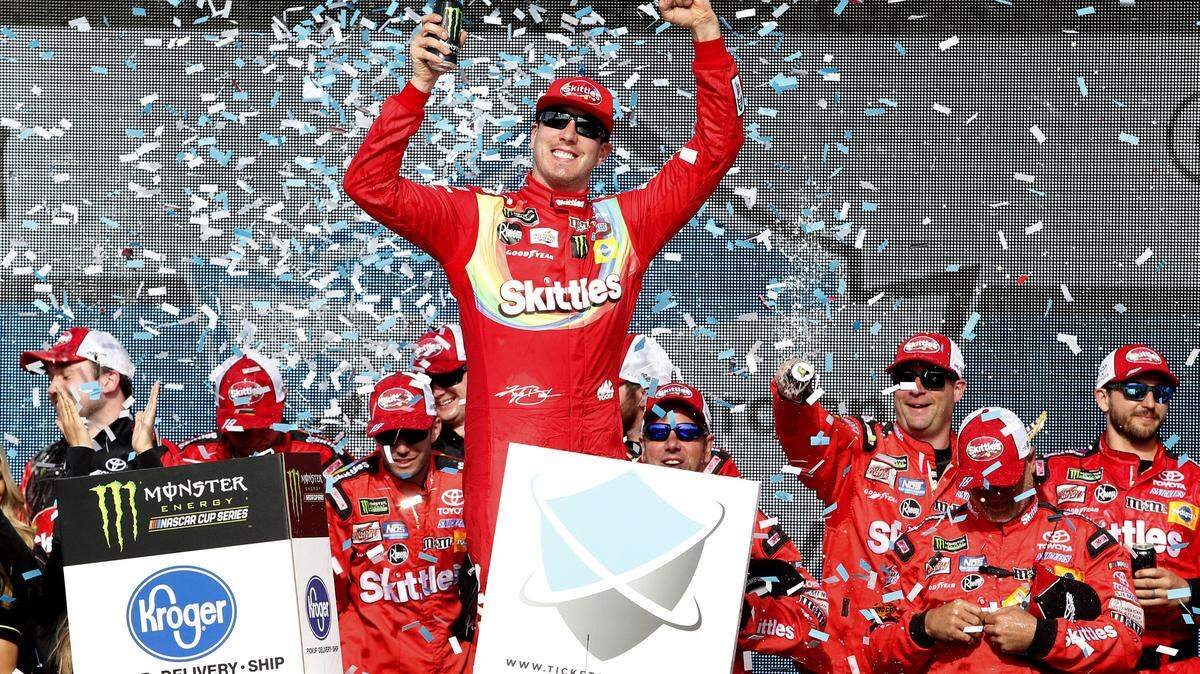 Kyle Busch celebrates in Victory Lane after winning the NASCAR Cup Series race at ISM Raceway on Sunday.