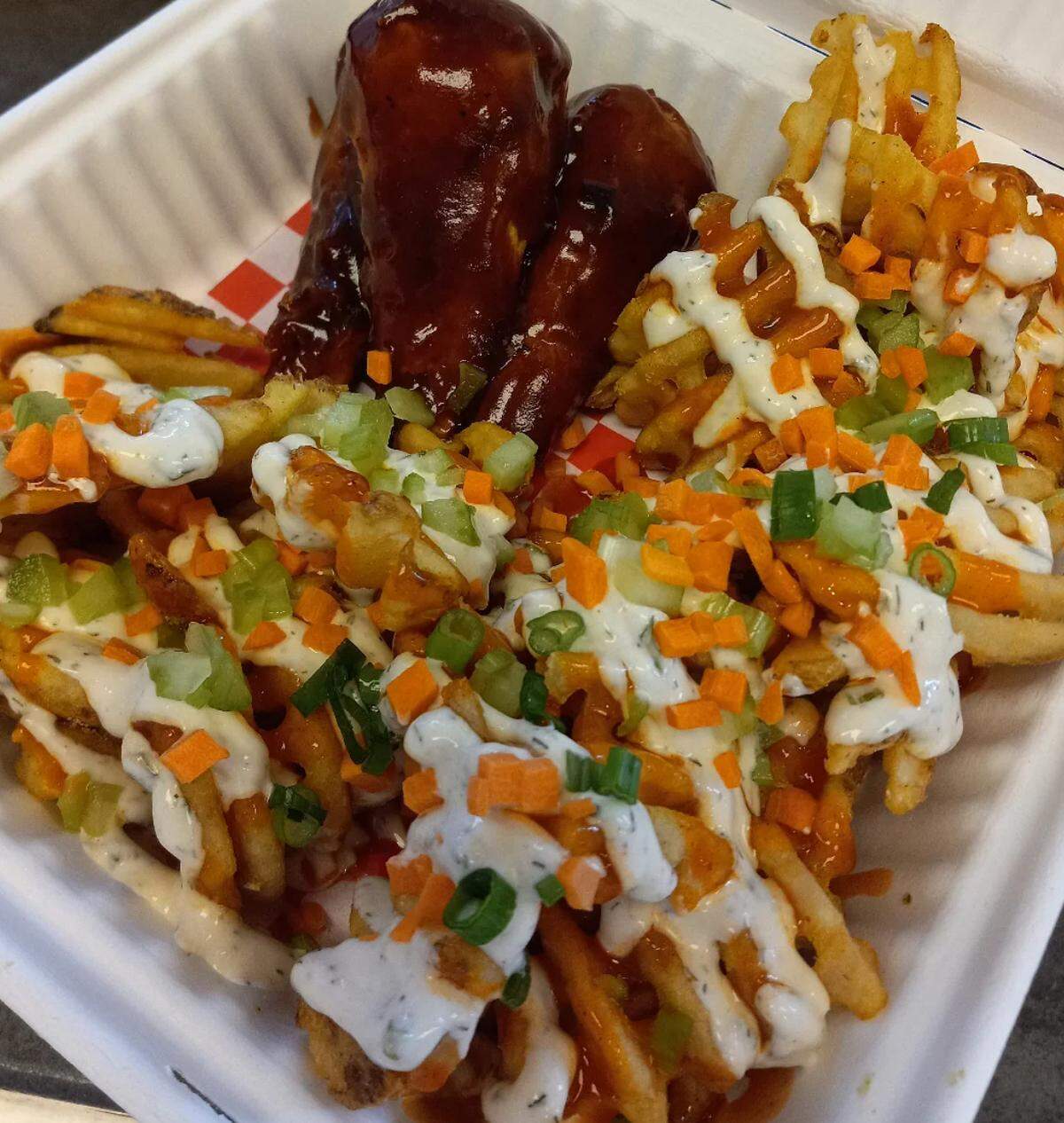 Soul Miner’s Garden vegan and gluten-free Buffalo ranch waffle fries are seasoned with ranch powder and topped with Buffalo sauce, house-made ranch, chopped celery, carrots and green onions.