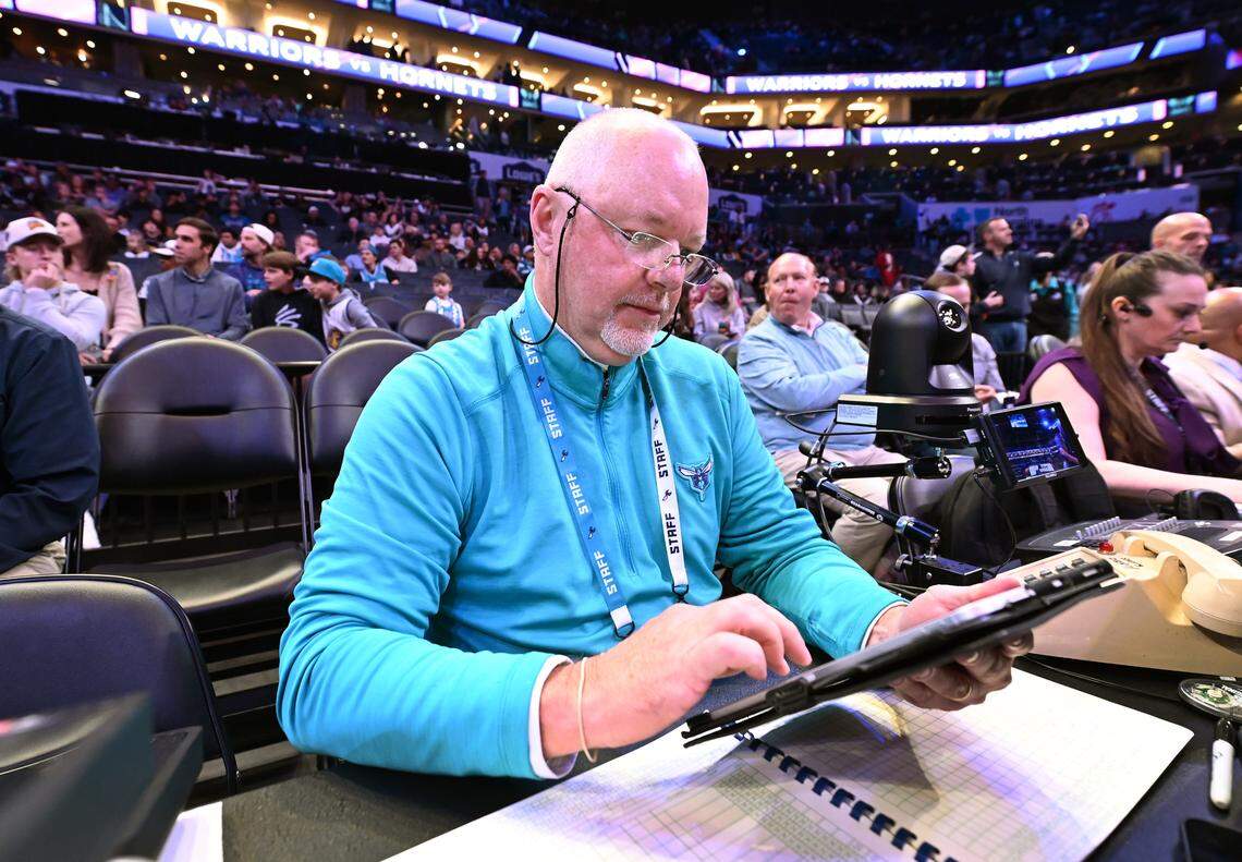 Charlotte Hornets longtime official scorer Michael Harwood looks over his i-pad prior to the team’s game against the Golden State Warriors on Monday, March 3, 2025 at Spectrum Center in Charlotte, NC.
