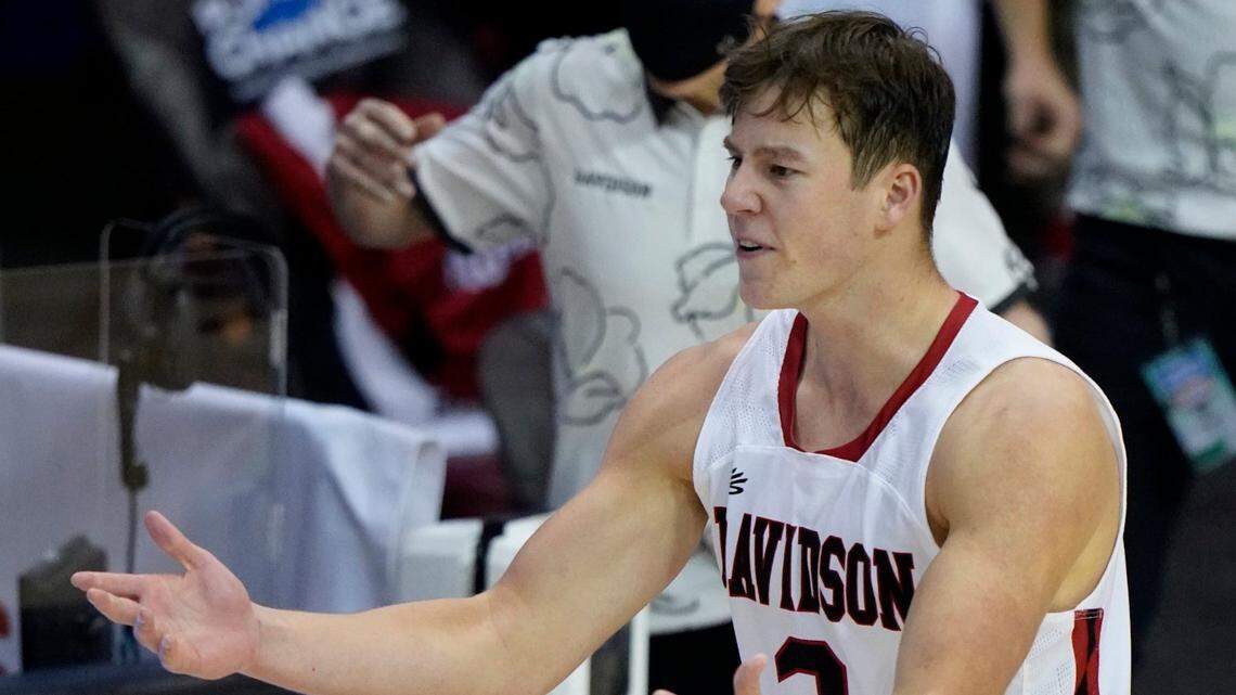 Davidson forward Sam Mennenga (3) and Davidson head coach Bob McKillop reacts to an official after missing the final shot in the last seconds of the second half of an NCAA college basketball game against Texas in the Maui Invitational tournament, Monday, Nov. 30, 2020 in Asheville, N.C. Texas won 78-76. (AP Photo/Kathy Kmonicek)