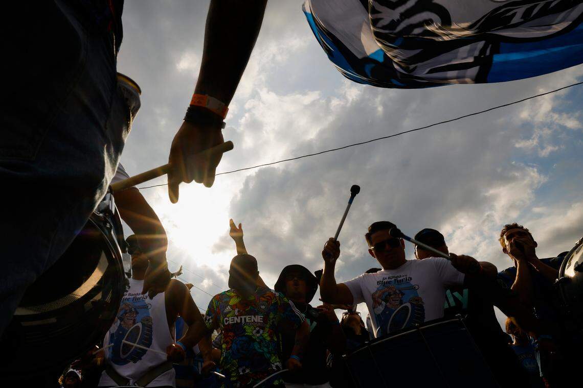 Charlotte FC fans march along Stadium View Drive on their way to the match between Charlotte FC and Columbus Crew at Bank of America Stadium in Charlotte, N.C., Saturday, July 30, 2022.