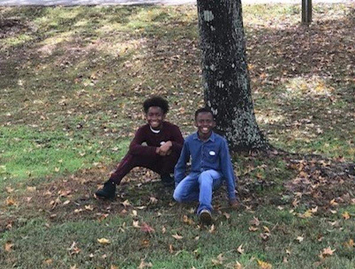Jahkai (left) and Kinrick Graham enjoy spending Sundays at Freedom Park with their aunt, Joy, who adopted them and brought them from Delaware to Charlotte to live with her.