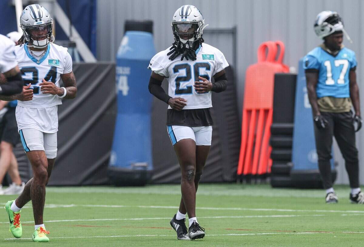 Panthers cornerback Chau Smith-Wade, center, practices during mandatory minicamp in Charlotte on Tuesday, June 9, 2026