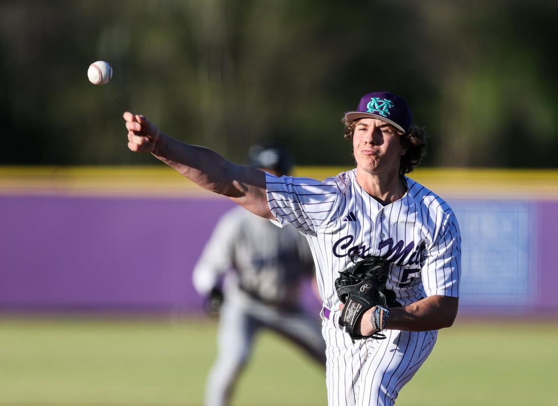 Cox Mill Chargers Troy Sherman pitches against the Lake Norman Wildcats at Cox Mill High School in Concord, N.C., on Friday, April 12, 2024.