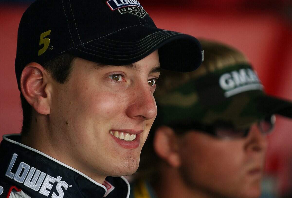 2/12/04 (L) Busch driver Kyle Busch enjoys some down time in the garage area at Daytona International Speedway following practice Thursday morning with (R)Ricky Hendrick. JEFF SINER/STAFF