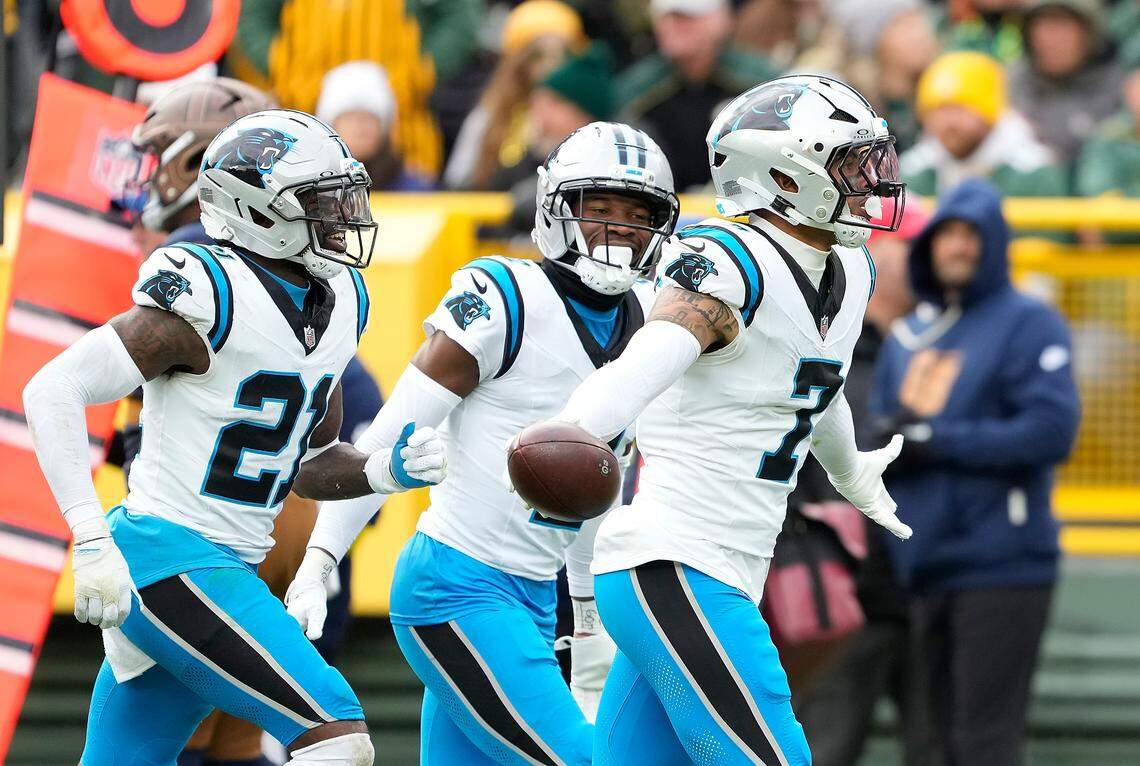 GREEN BAY, WISCONSIN - NOVEMBER 02: Tre'von Moehrig #7 of the Carolina Panthers reacts after an interception in the third quarter against the Green Bay Packers in the game at Lambeau Field on November 02, 2025 in Green Bay, Wisconsin. (Photo by Patrick McDermott/Getty Images)