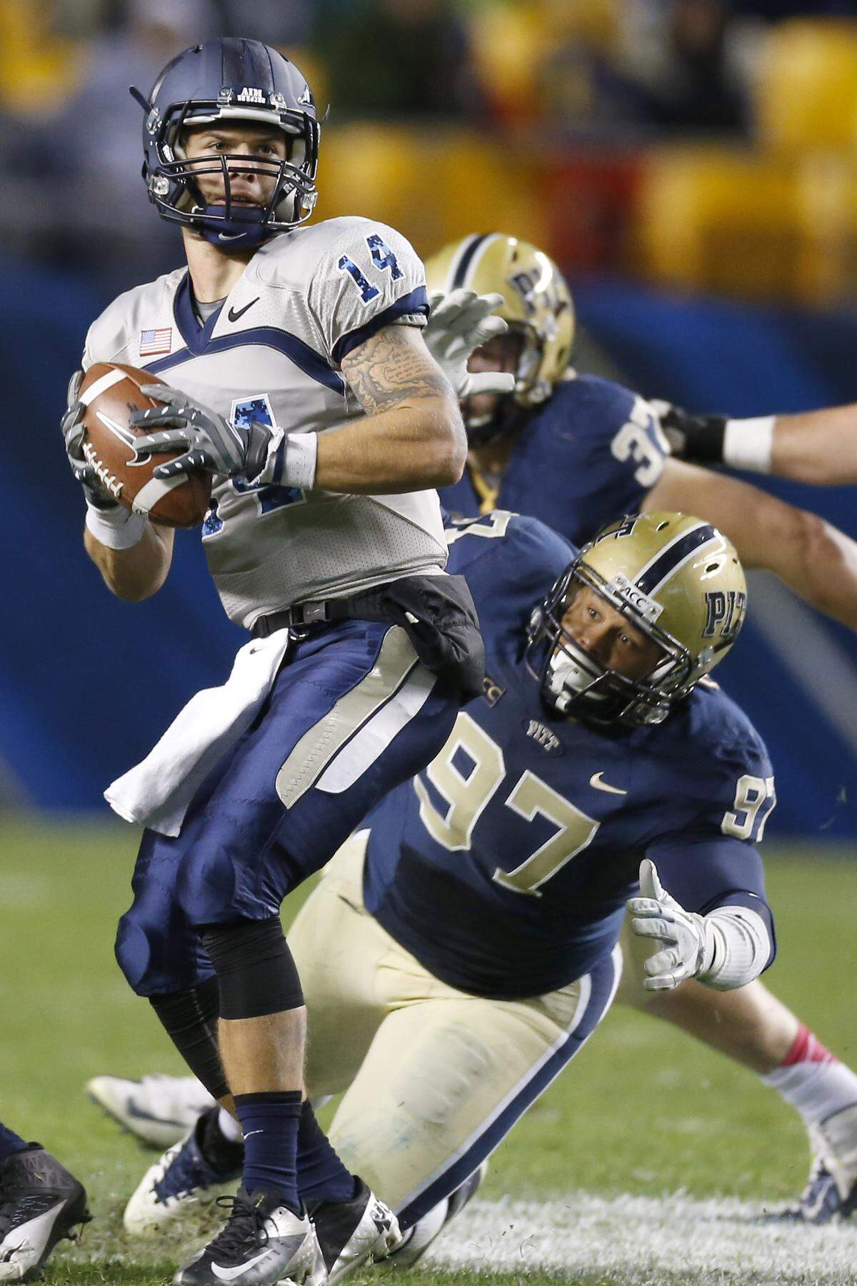 FILE - In this Oct. 19, 2013, file photo, Pittsburgh defensive lineman Aaron Donald (97) pressures Old Dominion quarterback Taylor Heinicke (14) during an NCAA football game in Pittsburgh. Donald, the most-decorated defensive player during the 2013 college football season with four major awards, could be the Panthers’ highest draft pick since wideout Larry Fitzgerald was taken third overall by the Arizona Cardinals in 2004. (AP Photo/Keith Srakocic, File)