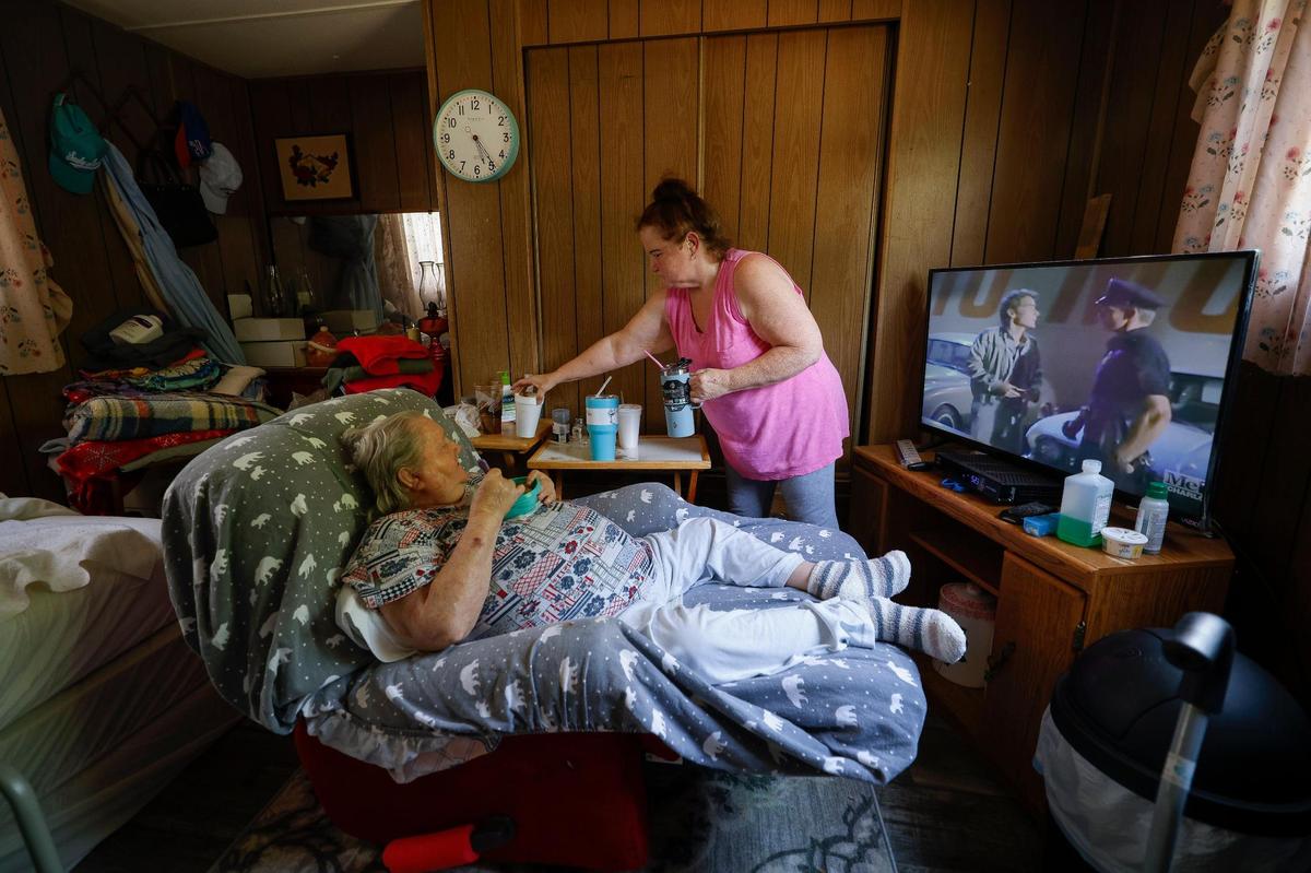 Stacy Sprinkle cares for her 82-year-old mother Mary, who she shares her mobile home with. Sprinkle has made numerous improvements to their home over the years, but due to the age the home it cannot be moved and will be demolished as residents of the Countrywoods Mobile Home Park are being forced out. Photo from May 2, 2022.