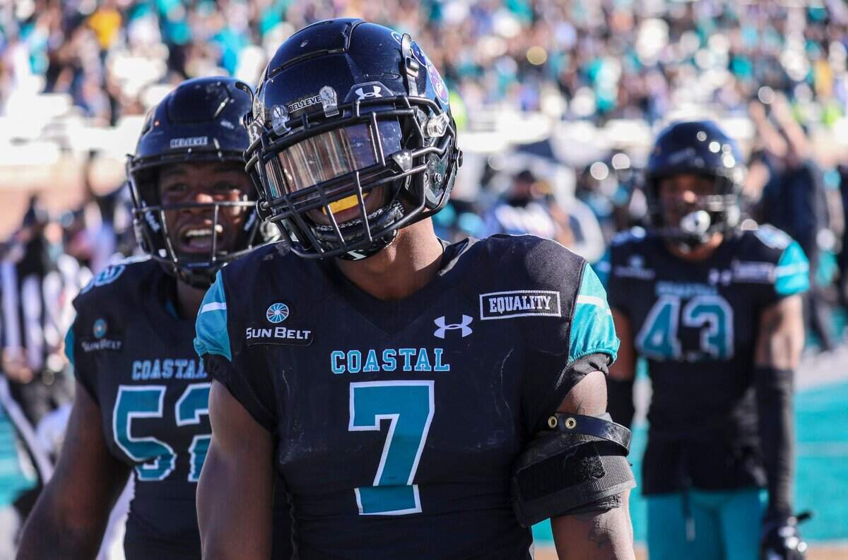 Coastal Carolina’s D’Jordan Strong celebrates his defensive touchdown following an interception against Appalachian State at Brooks Stadium in Conway on Nov. 21, 2020.
