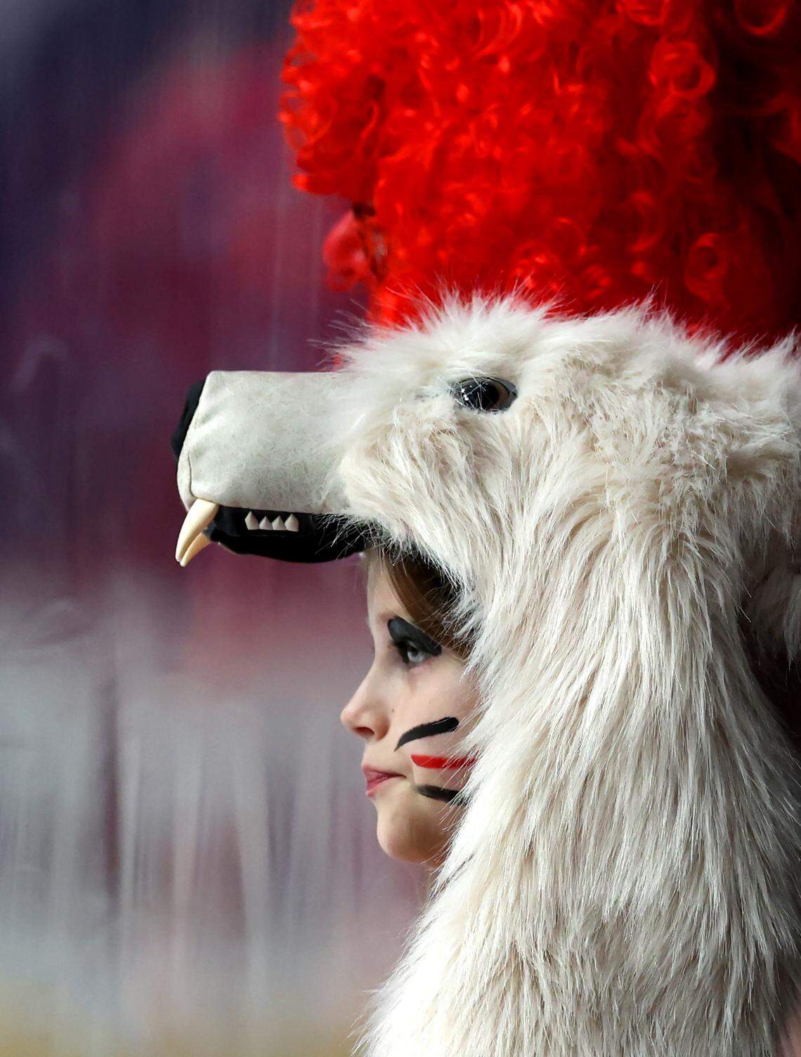 A young Charlotte Checkers watches the team warmup prior to action against the Iowa Wild on Friday, October 17, 2025 at Bojangles Coliseum in Charlotte, NC. 