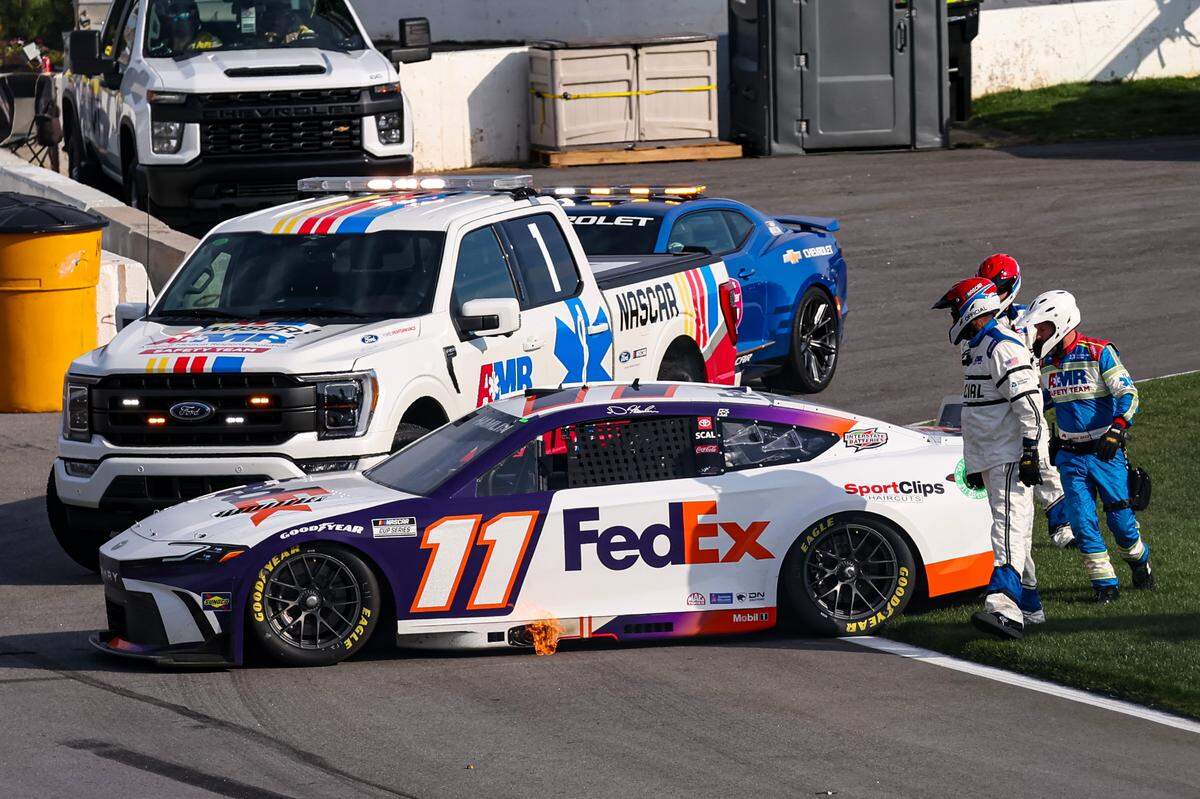 Feb 25, 2024; Hampton, Georgia, USA; The car of NASCAR Cup Series driver Denny Hamlin (11) comes to a stop at the end of pit road after a spin during the Ambetter Health 400 at Atlanta Motor Speedway.