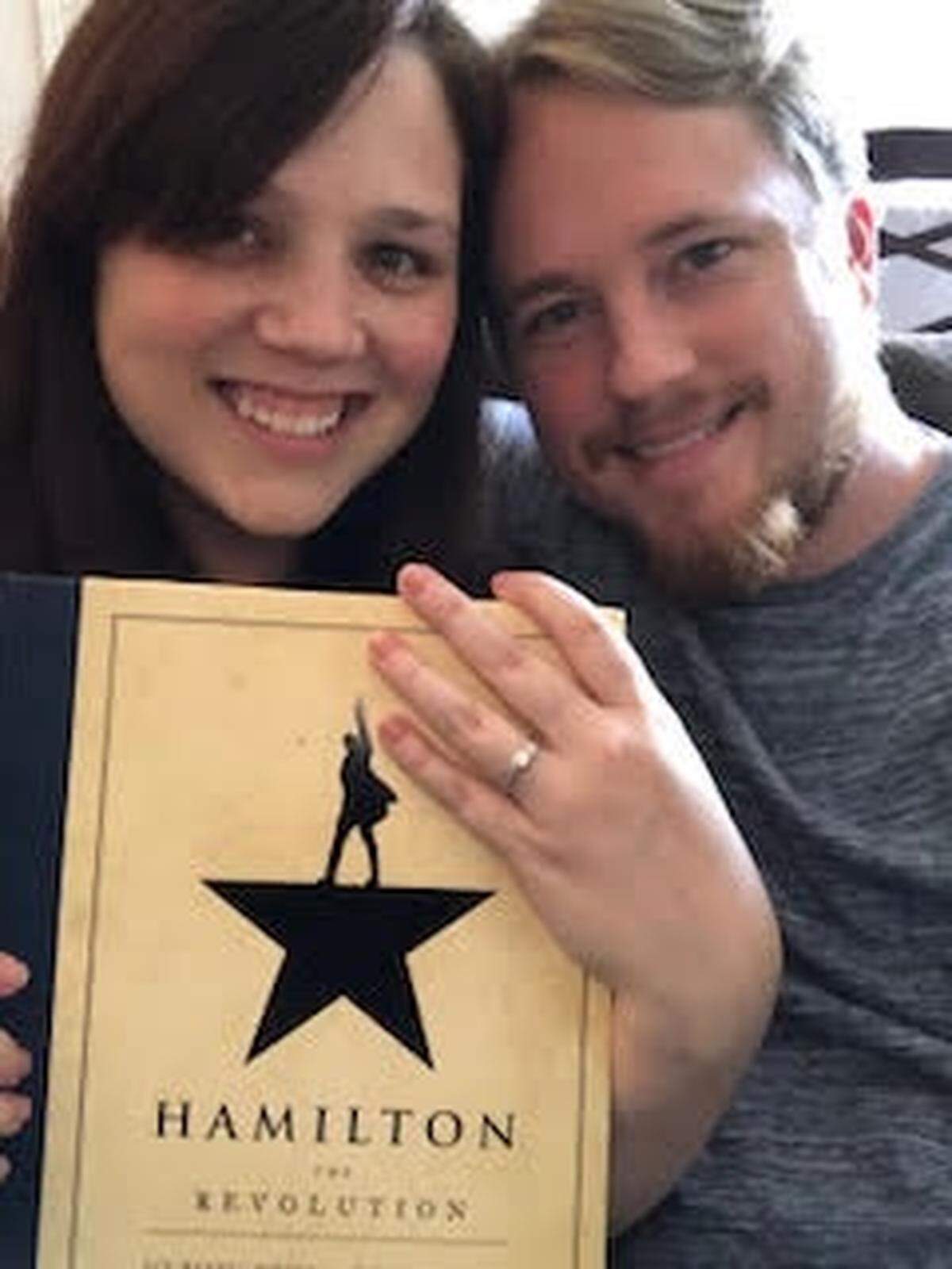 After they got engaged, Amanda Bledsoe displays her ring with Andy Pippin, and, appropriately, the book about “Hamilton.”
