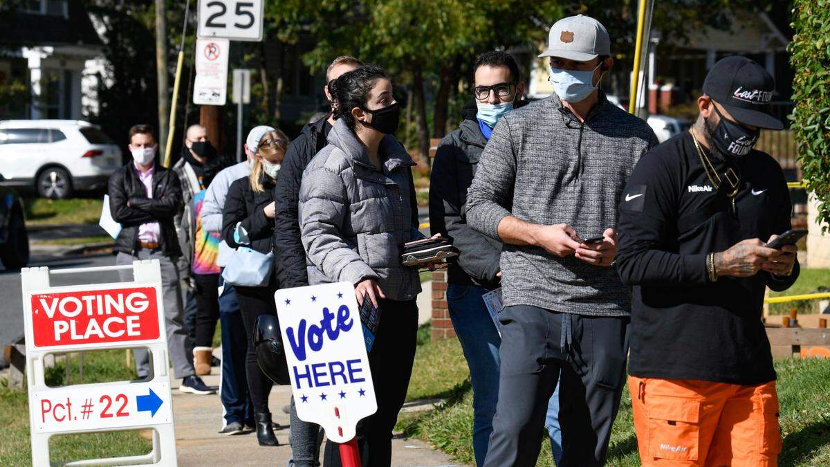 Voters wait in line before casting their a ballots at the Greater Galilee Baptist Church precinct on Tuesday, November 3, 2020.