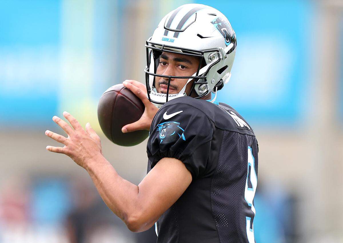 Carolina Panthers quarterback Bryce Young drops back to pass during practice on Tuesday, August 6, 2024.