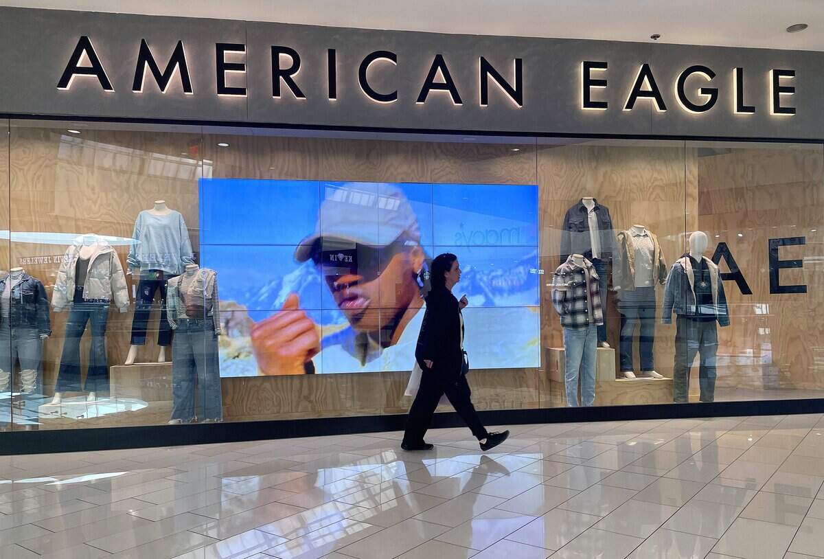 GLENDALE, CALIFORNIA - NOVEMBER 21: A shopper walks by an American Eagle store on November 21, 2023 in Glendale, California. Shares of clothing retailer American Eagle fell sharply after the company issued an unimpressive forecast for holiday sales. (Photo by Justin Sullivan/Getty Images)