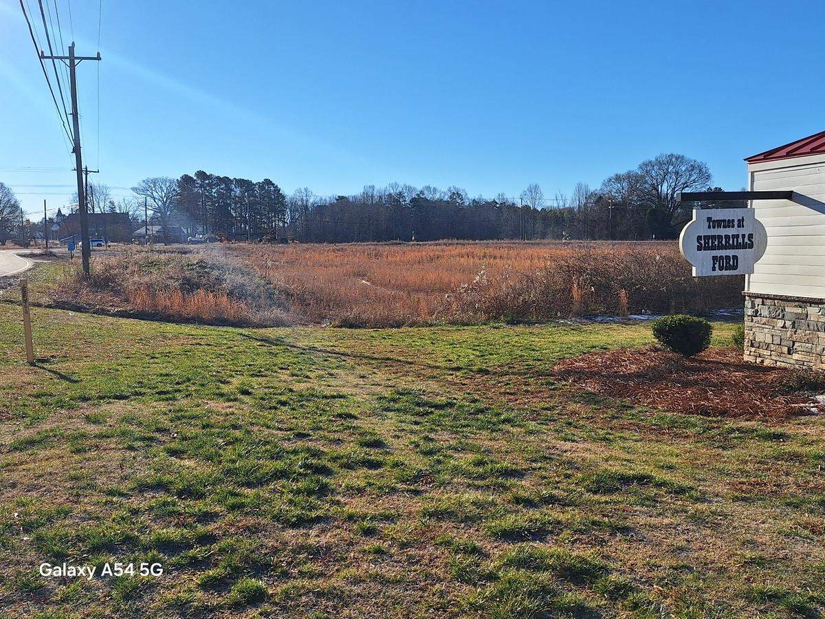 The weed-filled acreage of the planned Terrell Town Center Area 2 development is shown from the Townes at Sherrills Ford subdivision on Sherrills Ford Road on Tuesday, Jan. 14, 2025.