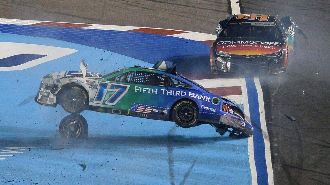NASCAR drivers Chris Buescher’s (17) car begins to flip after he and driver Daniel Suarez (99), wrecked after crossing the start/finish line during the Coca-Cola 600 at Charlotte Motor Speedway on Sunday, May 29, 2022. Buescher would flip down the front stretch before coming to rest on the roof of the car.