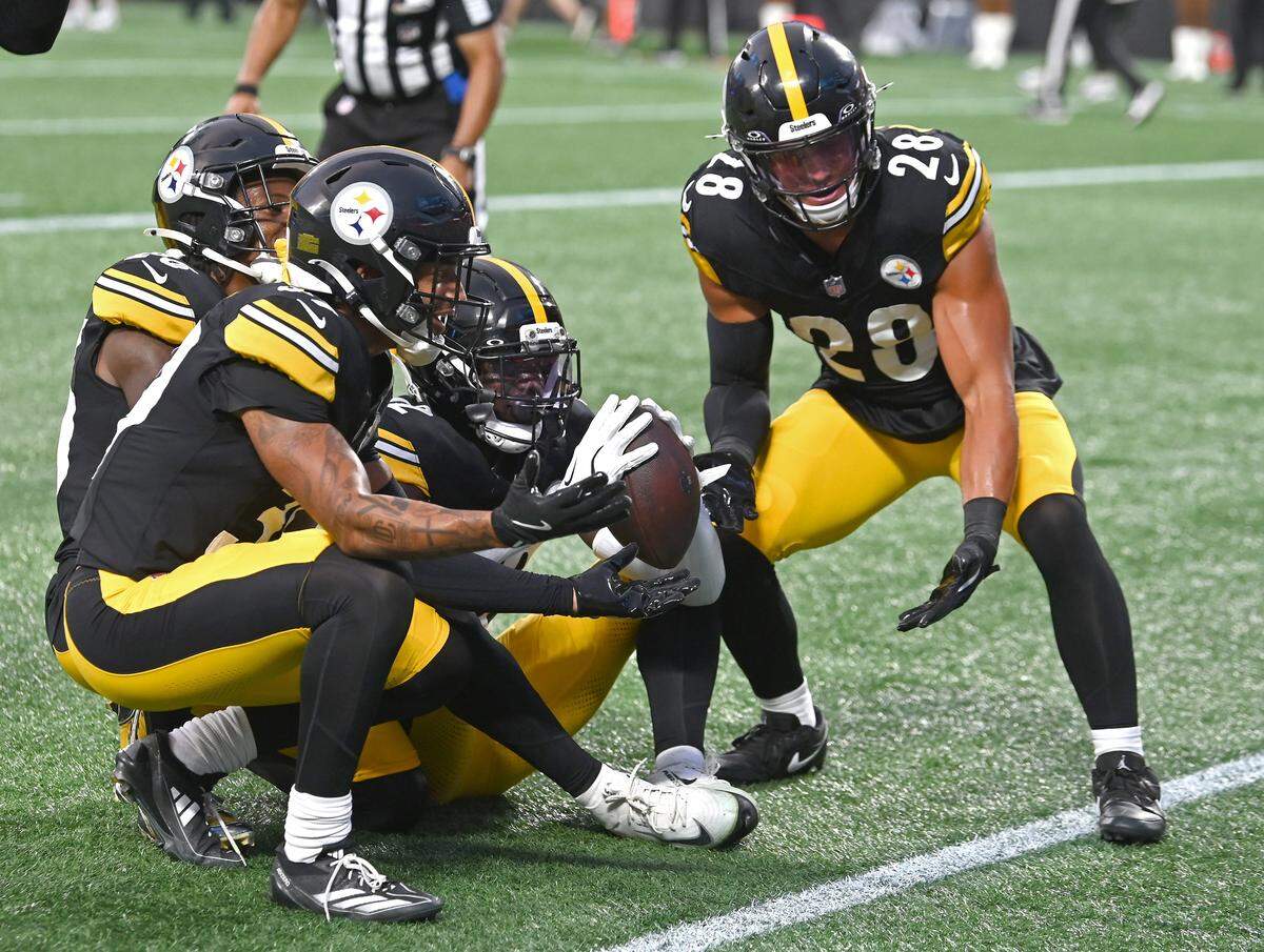 Pittsburgh Steelers cornerback James Pierre, center with ball and his teammates celebrate Pierre's interception of a pass by Carolina Panthers quarterback Jack Plummer in the end zone during action at Bank of America Stadium in Charlotte, NC on Thursday, August 21, 2025. The Steelers defeated the Panthers 19-10.