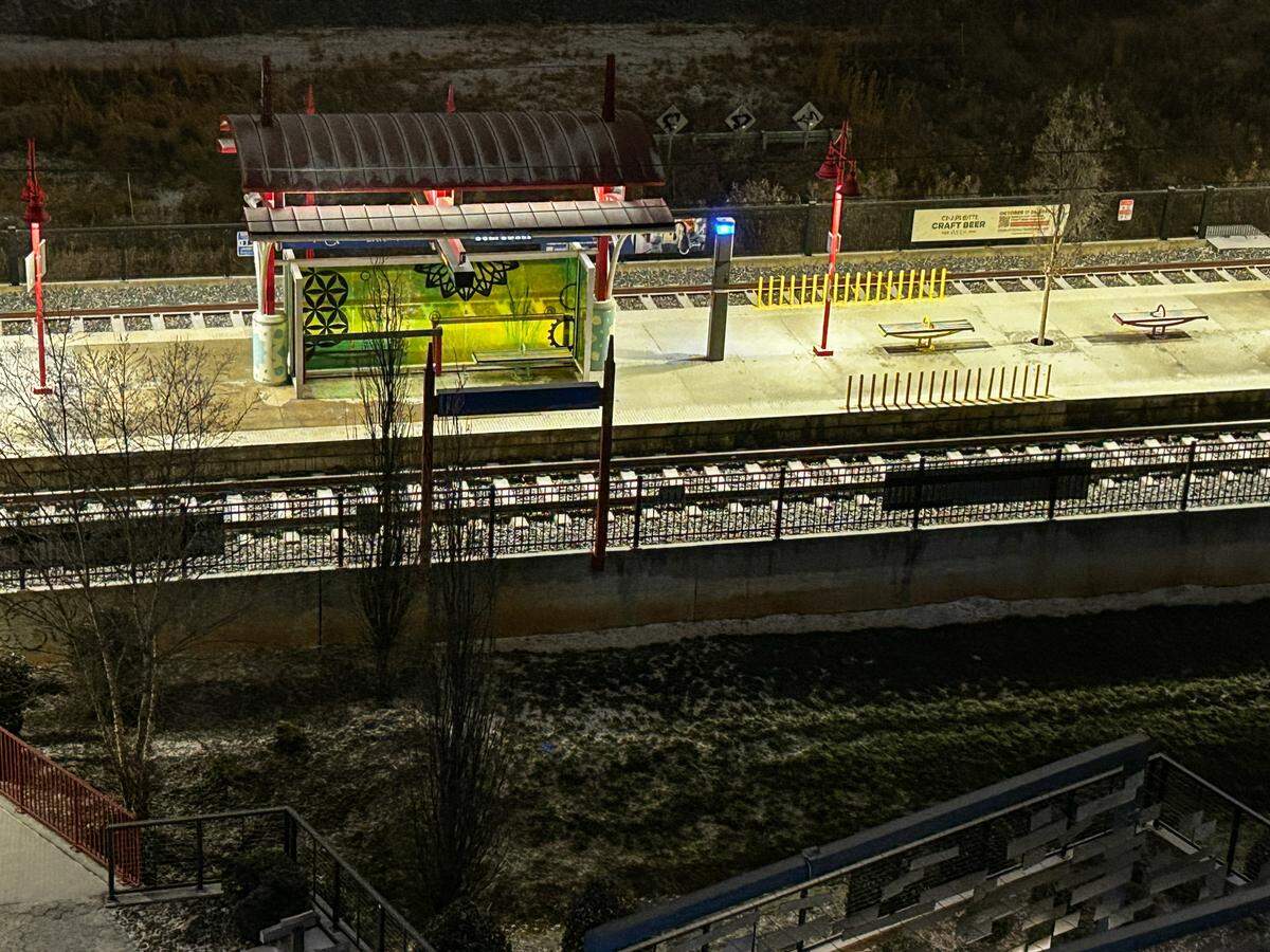 A light rail platform at the 36th Street station is covered in a thin mix of rain and sleet that moved into the Charlotte area early Sunday, January 25, 2026.