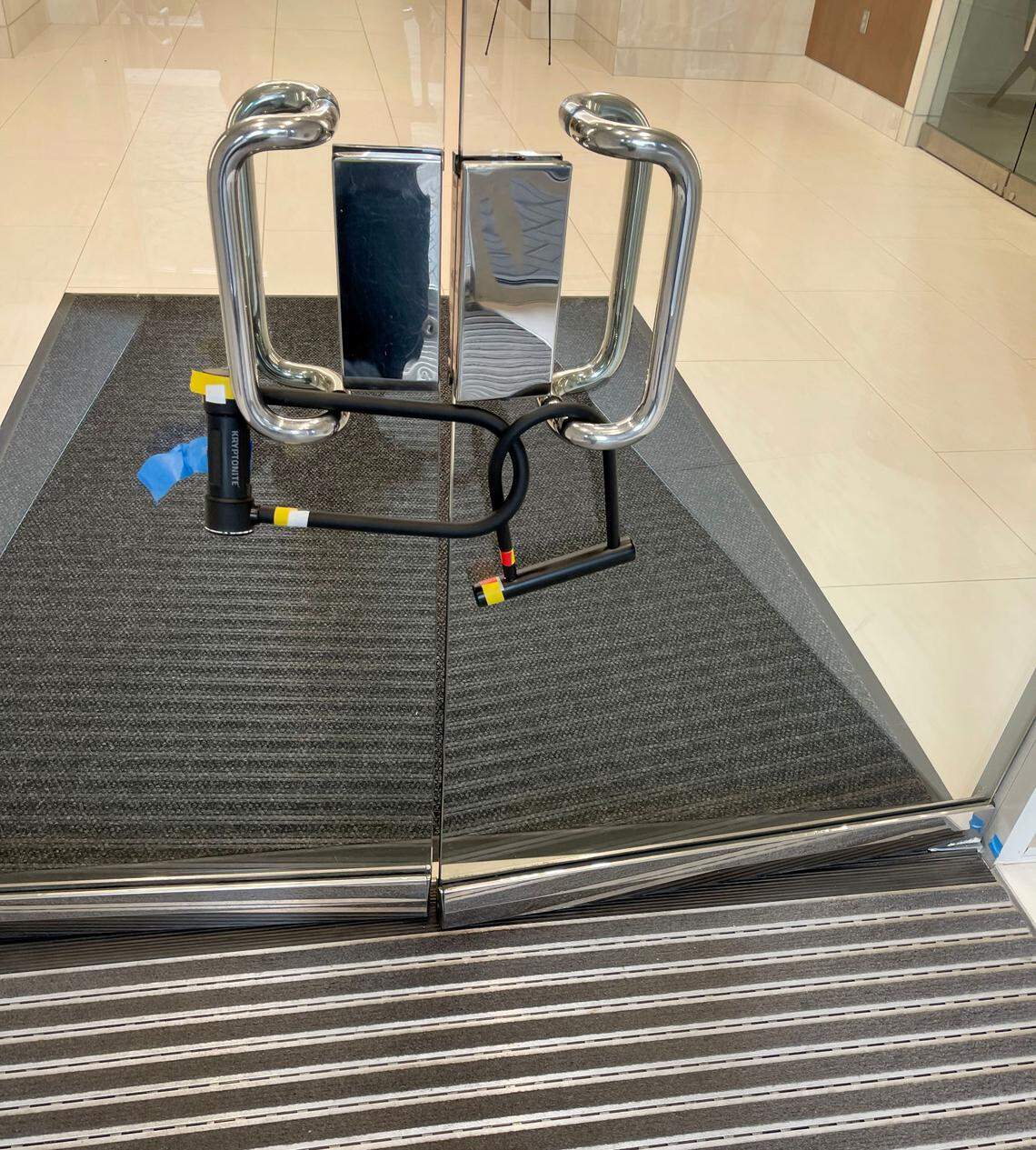 Climate activists used bike locks to keep people out of a Charlotte office building on Friday.