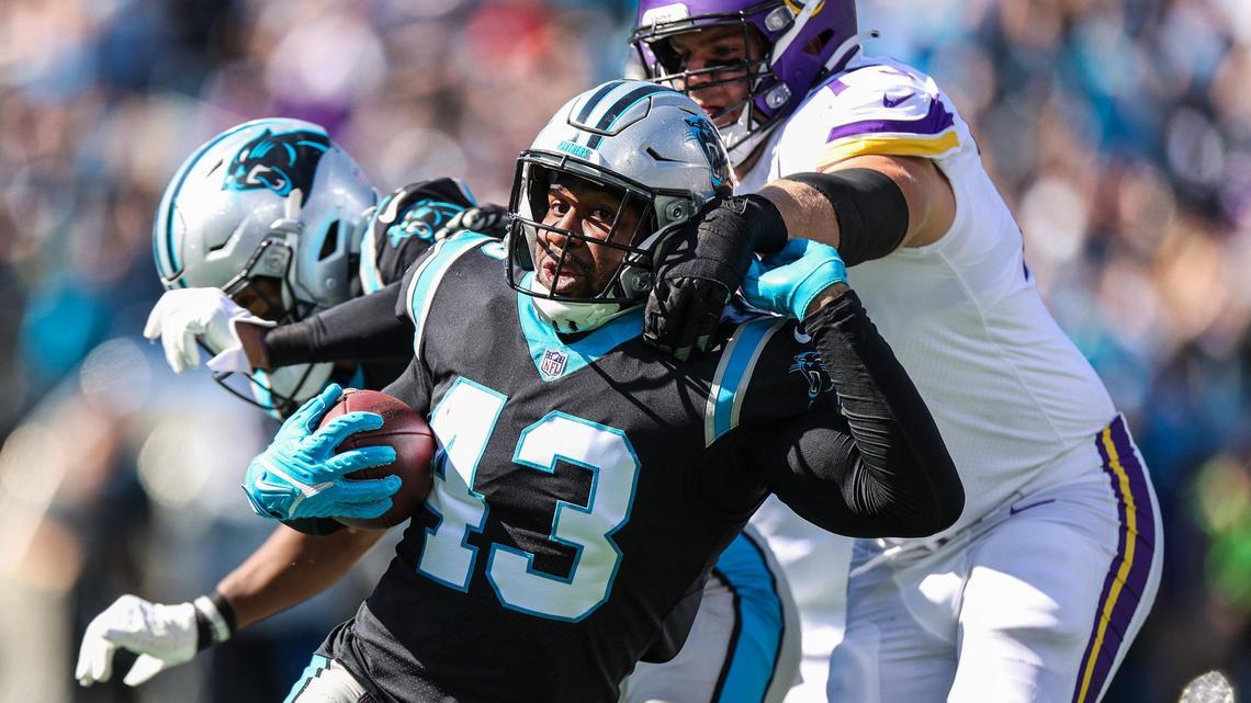 Panthers outside linebacker Haason Reddick, front center, pushes away Vikings defender as he runs with the ball after intercepted during the game at Bank of America Stadium on Sunday, October 17, 2021 in Charlotte, NC.