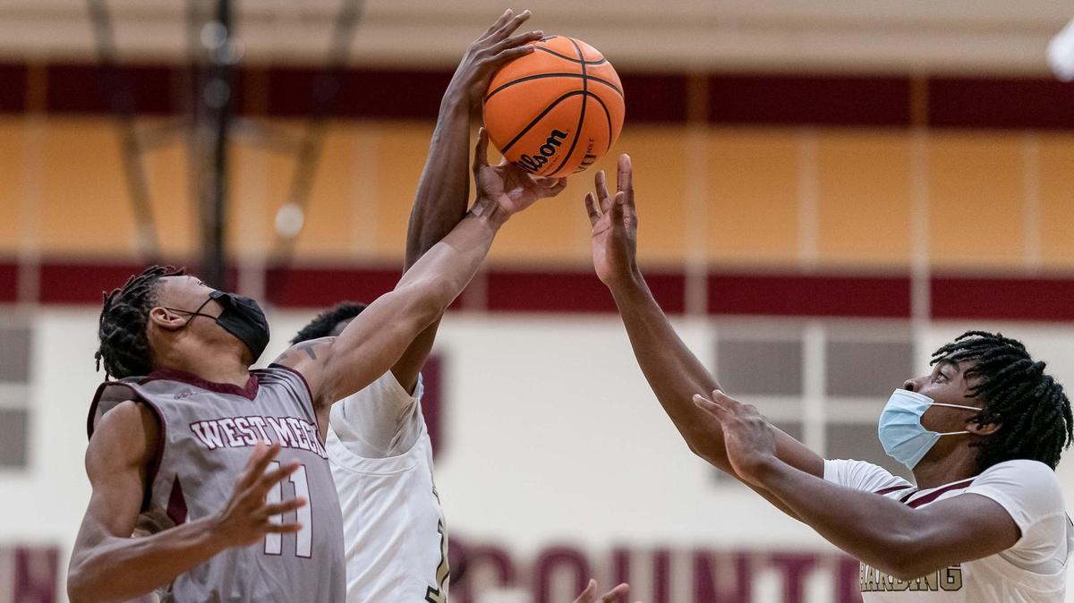 West Meck’s Wardwell Williams (left) battles for the rebound. Harding would host West Meck Wednesday February 17, 2021.