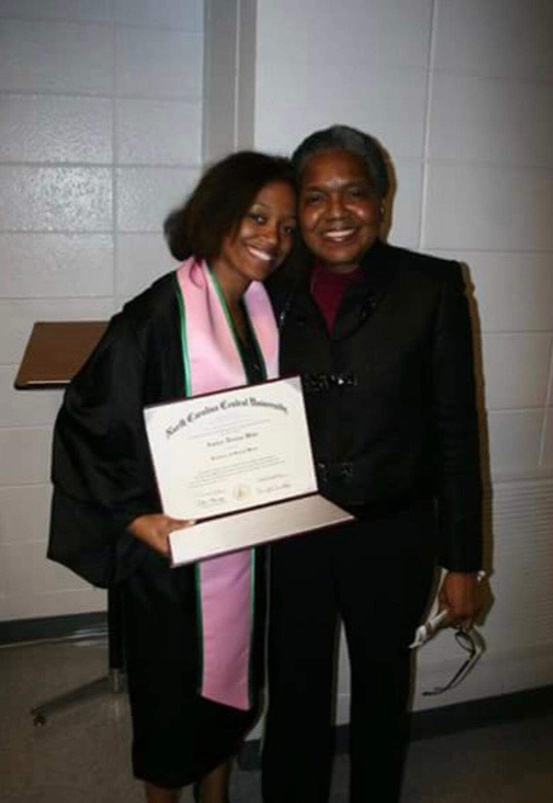 Amber Wike, left, at her graduation from NC Central University in 2013. Wike transferred to Central after realizing she couldn’t afford to take on the debt required to keep attending Bennett College, a private institution, in Greensboro.